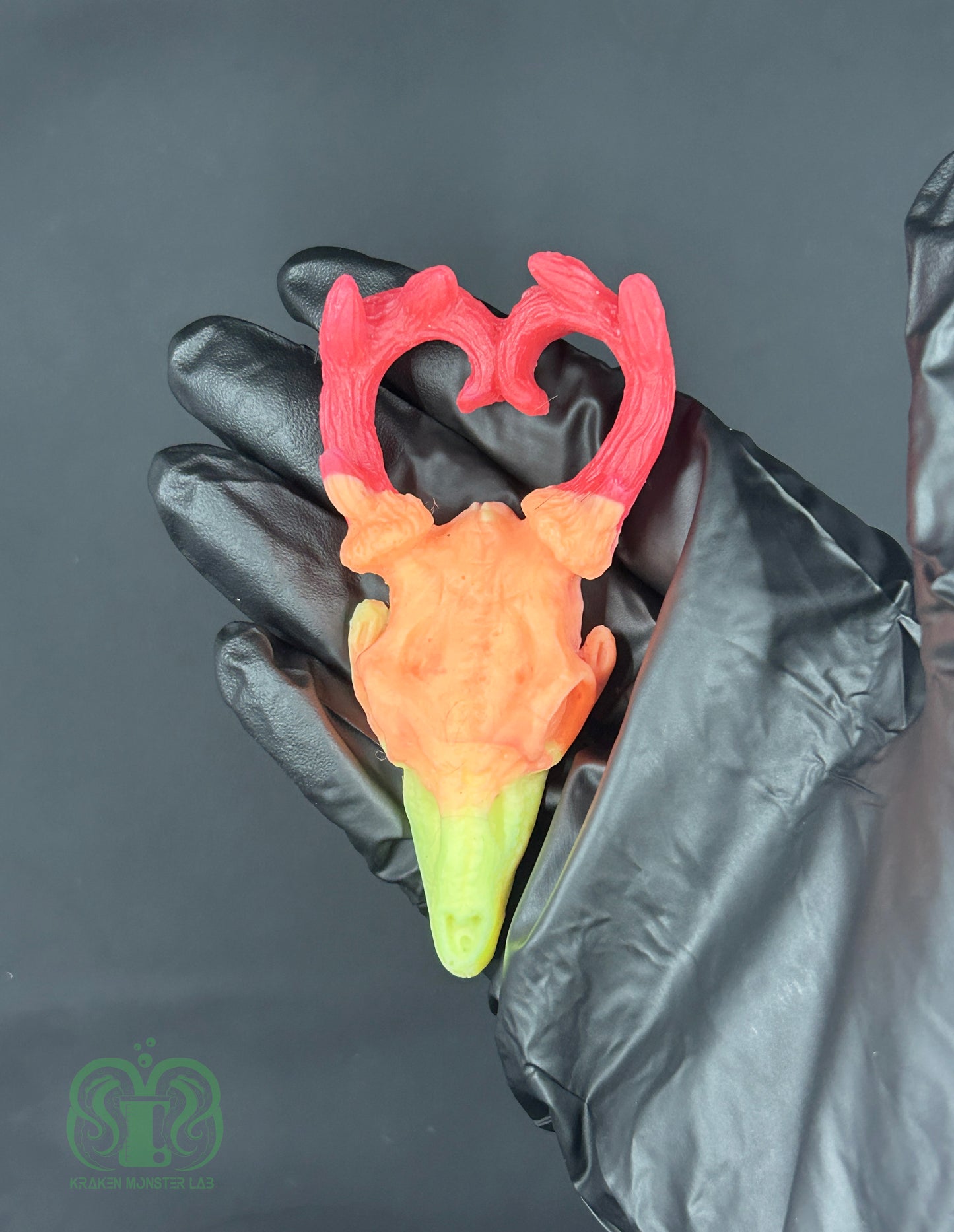 Flop- UV Neon Sunset Deer Deer Skull Squishy- Red, Orange & Yellow